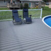 Image of a poolside composite deck built with the Optima Dekk LT board profile in River Stone.